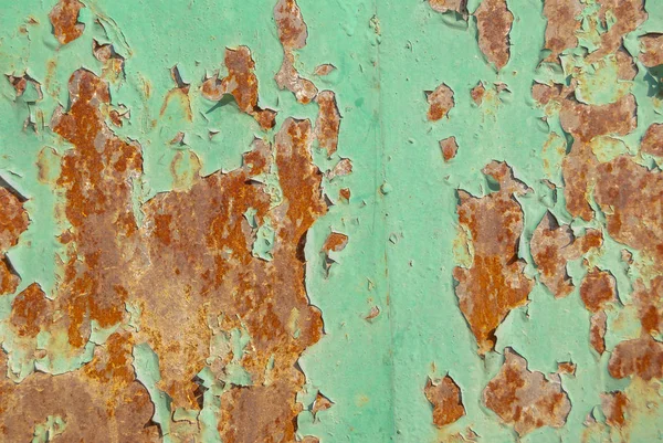 錆びた鉄の表面に古い塗料の質感の背景が残っています — ストック写真