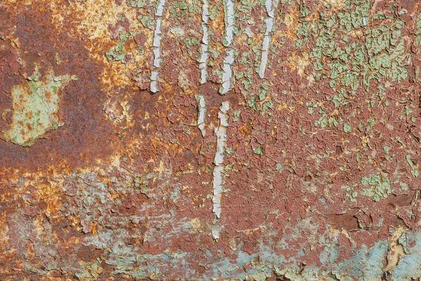 Superfície de ferro enferrujado com restos de tinta antiga, tinta lascada, fundo de textura — Fotografia de Stock