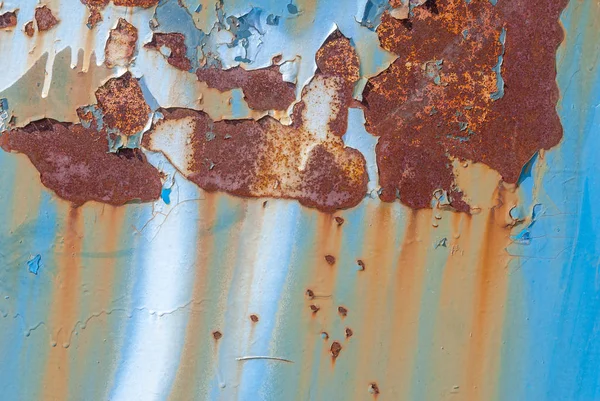 Surface of rusty iron with remnants of old paint, chipped paint, texture background — Stock Photo, Image