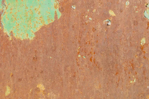 錆びた鉄の表面に古い塗料の質感の背景が残っています — ストック写真