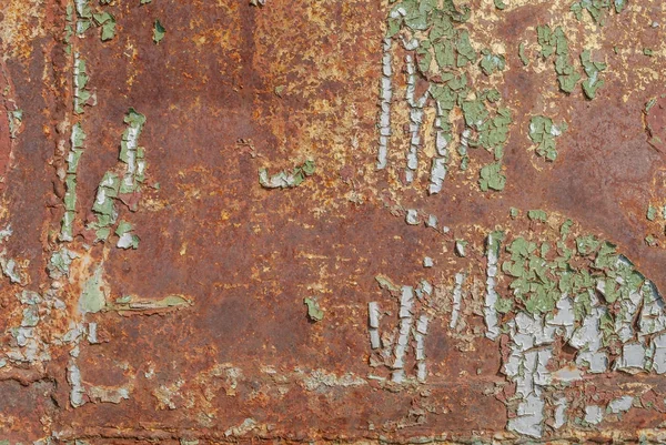 Superfície de ferro enferrujado com restos de tinta antiga, tinta lascada, fundo de textura — Fotografia de Stock