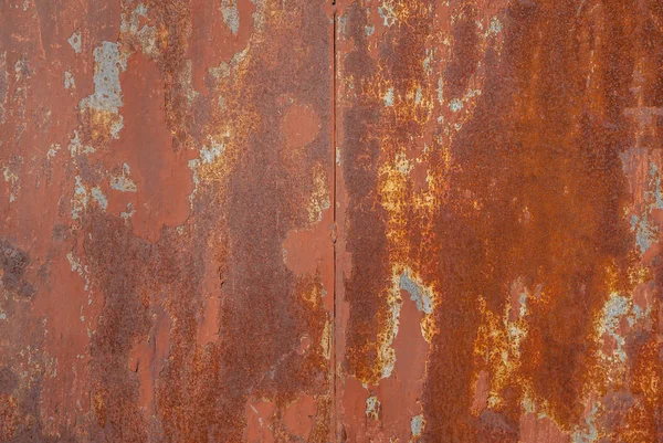 Surface of rusty iron with remnants of old paint, texture background — Stock Photo, Image