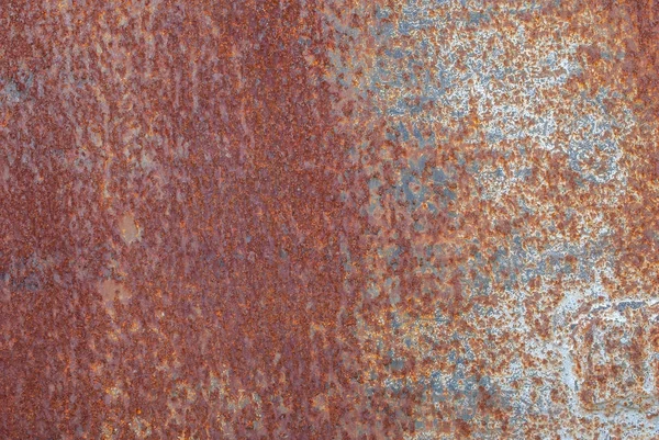 Поверхность ржавого железа с остатками старой краски, щебень краски, текстурный фон — стоковое фото