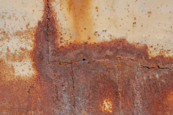 Superficie de hierro oxidado con restos de pintura vieja, fondo de textura — Foto de Stock