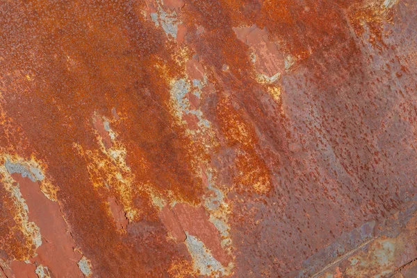 Oppervlak van roestig ijzer met resten van oude verf, textuur achtergrond — Stockfoto