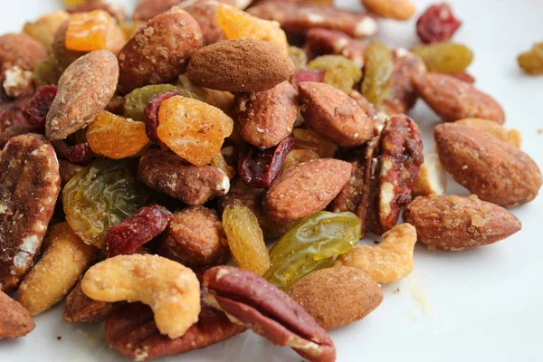 Mixed nuts on white plate — Stock Photo, Image
