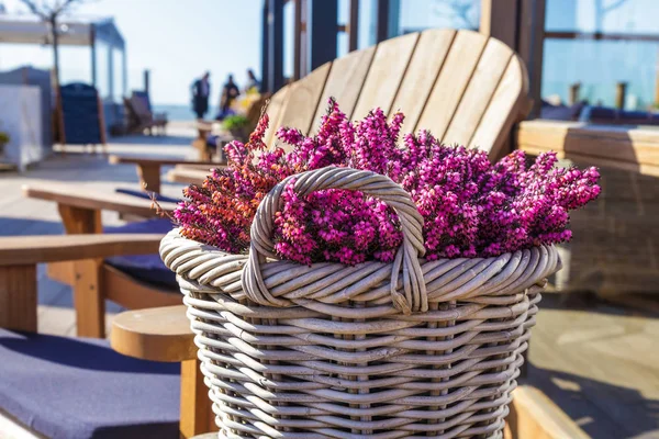 table cafe beach sea flowers vase blue white lavender purple chairs sand sun light romantic pink vintage