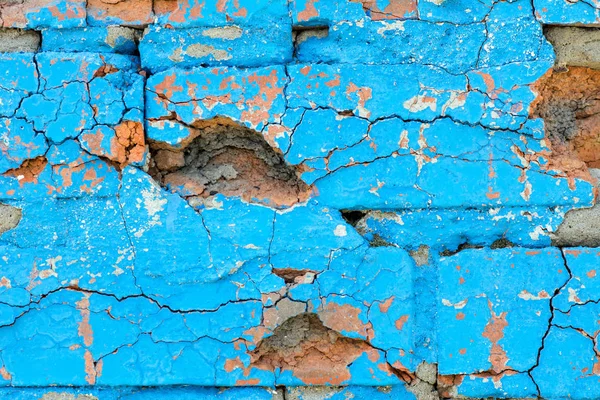 background brick wall painted light blue paint old crumbling