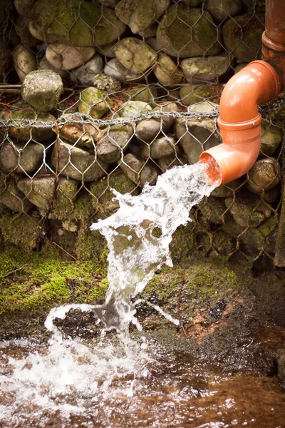 Wastewater pipe taking water out — Stock Photo, Image