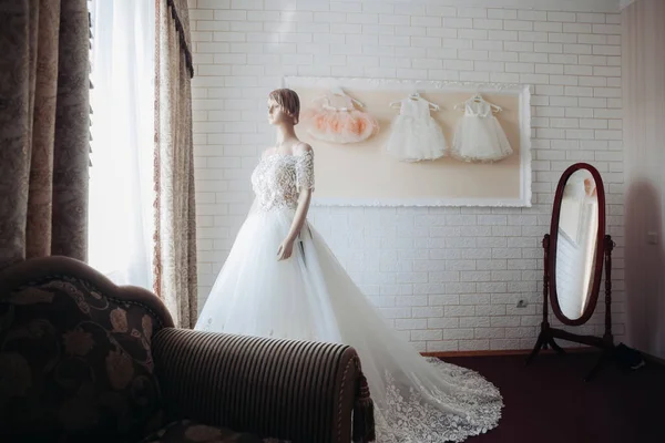 Interior of wedding shop. Wedding dress on a mannequin