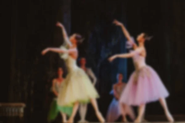 Abstract blurred backgroud. Ballet dancers dance on the stage