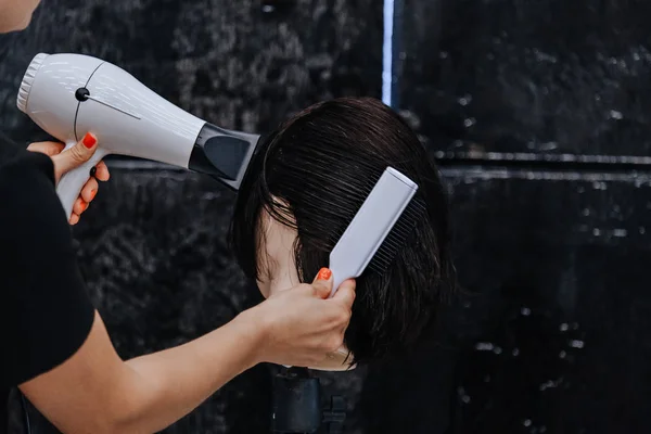 Training hair styling on a mannequin