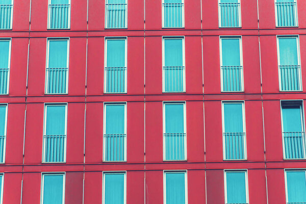 Red and blue facade of office building