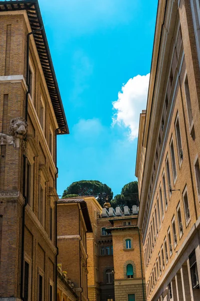 Brown buildings in a street with ancient facade — Stock Photo, Image