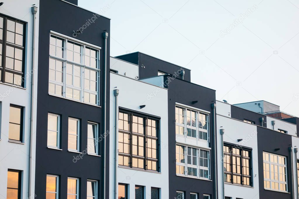 townhouses with warm light reflections in the windows