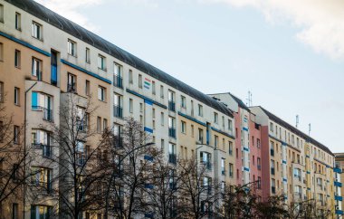 low colored apartment houses in a street