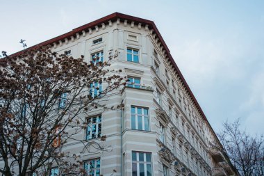 corner building with creme facade on a cloudy day