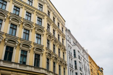 yellow and white vintage houses on a cloudy background