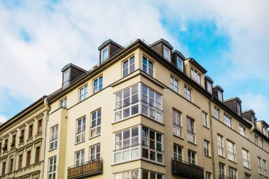 yellow corner apartment house in a street at berlin, mitte