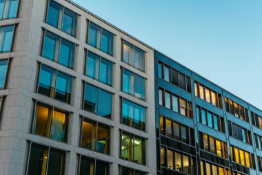 cold colored apartment building with square windows