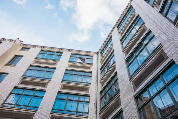 renovated brick apartment building with copy space in the sky