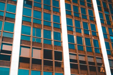 industrial facade with darken windows and white facade