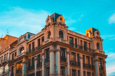 historical corner building at greece with beautiful sky