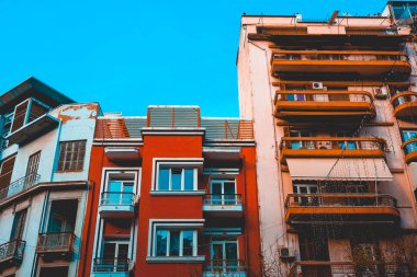 red and orange buildings with copy space in the sky