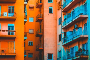 beautiful rural facade of industrial apartment complex with high contrasted orange and blue colors