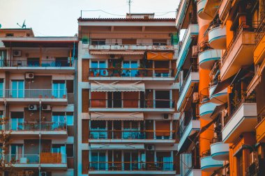blue and orange colored picture of apartment complex at thessaloniki