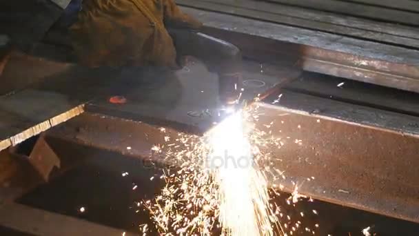 Welding works on a black background and a lot of sparks flying around, in blur. Slow motion — Stock Video