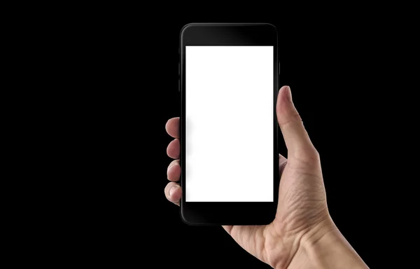 Moderne zwarte slimme telefoon in de hand van de man. Geïsoleerde wit scherm voor mockup. Zwarte achtergrond. — Stockfoto