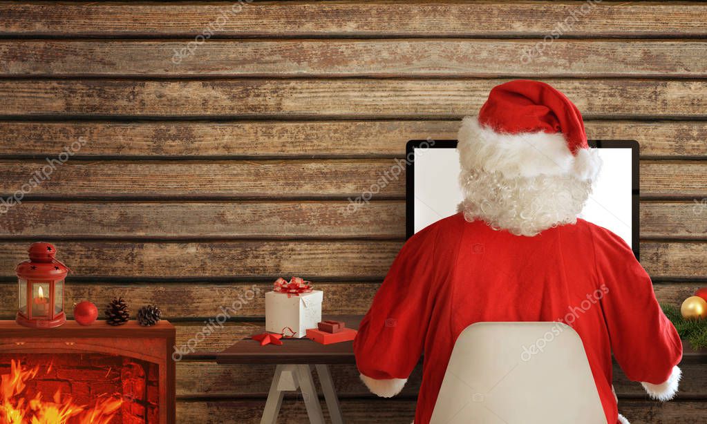 Santa Claus Shopping Online On Computer From His Warm Room In