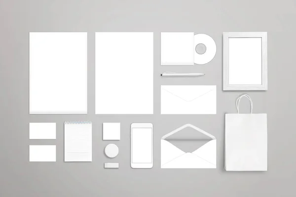 Stationery on desk. Blank white items for mockup. Top view. — Stock Photo, Image