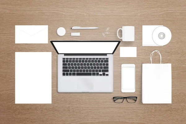 Laptop computer, mobile phone, stationery and office suplies on desk. Isolated white, blank items for mockup, design logo presentation.