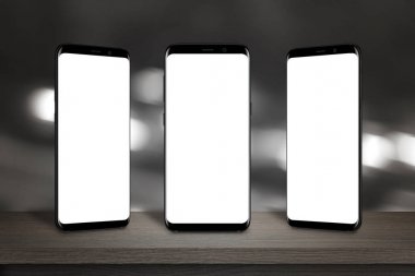 Üç cep telefonları ile izole perde mockup tablo için