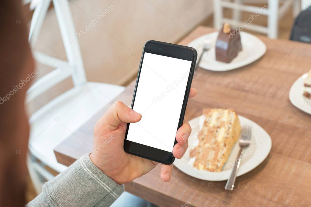Man holding smartphone with isolated, blank screen for app presentation