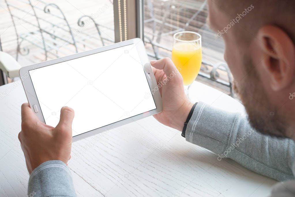 Tablet mockup. Guy hold tablet in horizontal position