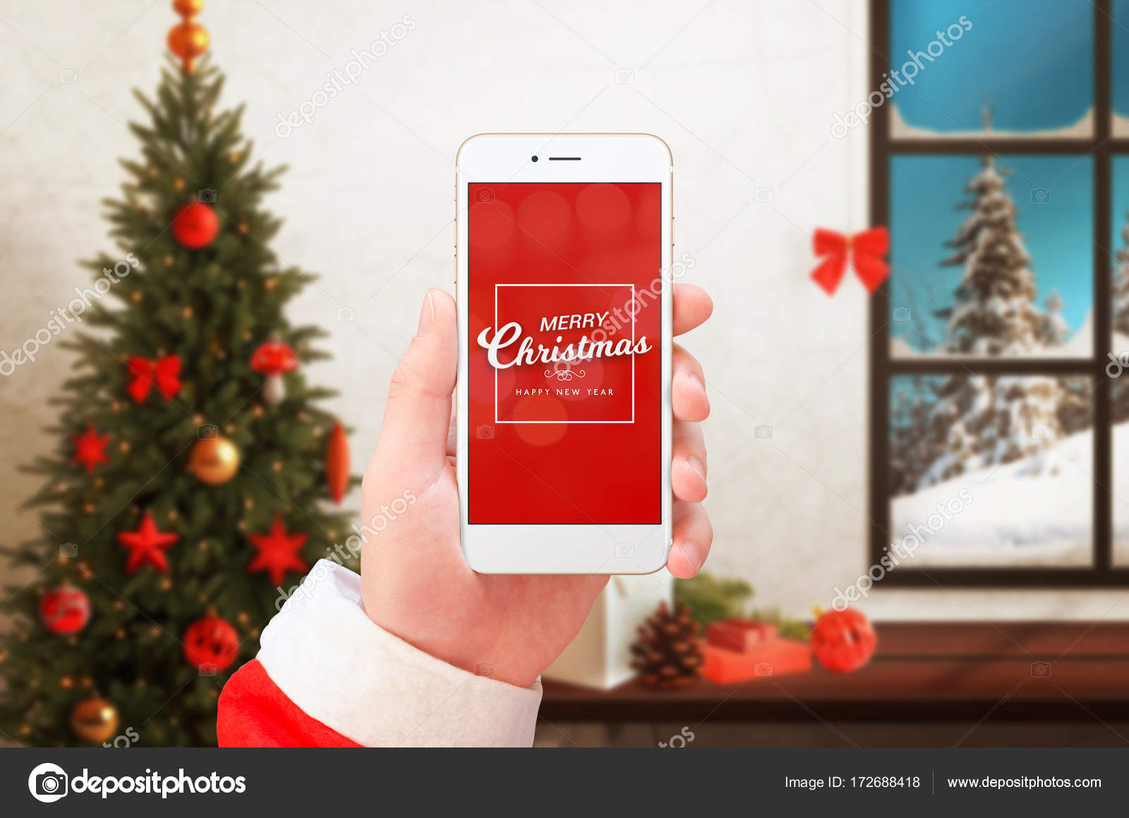 Handy in der Hand des Weihnachtsmannes, das frohe Weihnachten und einen