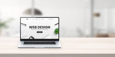 Web tasarımı stüdyo tanıtım sitesi ofis masası konsepti üzerine dizüstü bilgisayarda