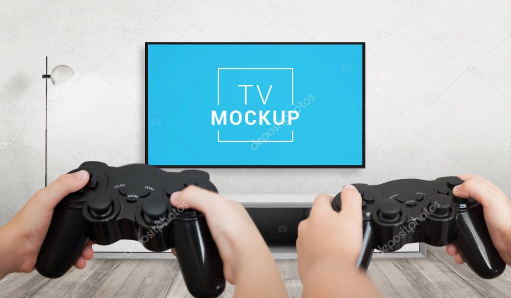 TV gaming mockup. Playing games concept with console gamepads in children's hands
