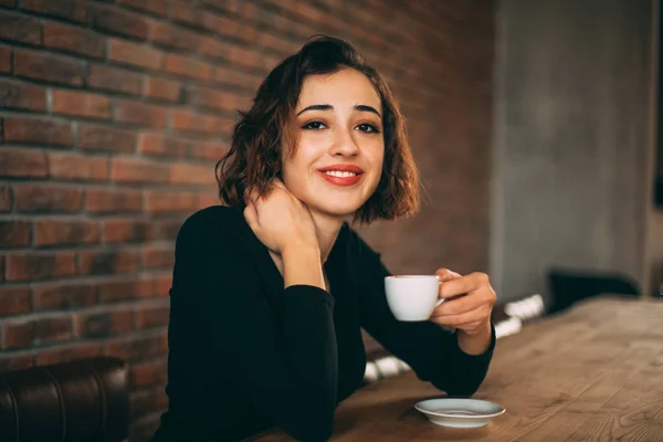 Beautiful Young Woman with Cup of Turkish Coffee