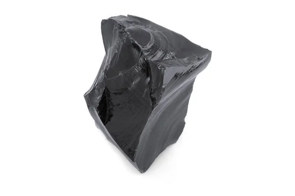 Black obsidian in white background — Stock Photo, Image