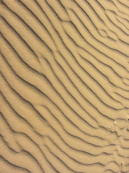 Жовтий пісок, переміщений вітром — стокове фото