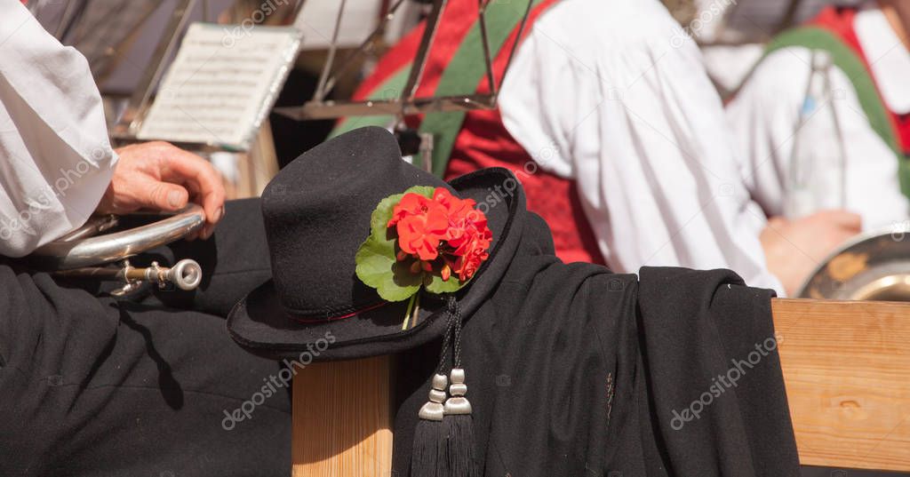 Detail of typical costume during an autumn local celebration in Val di Funes ( South Tyrol )