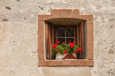 VAL ISARCO, ITALY - JULY 27, 2017: Detail (external window) from Castel Trostburg, one of the largest fortified complexes in South Tyrol. The history of the fortress dates back to the XII century