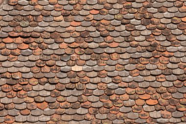 Detail from the terracotta roof of Castel Trostburg, one of the largest fortified complexes in South Tyrol. clipart