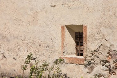 VAL ISARCO, ITALY - JULY 27, 2017: Detail (external window) from Castel Trostburg, one of the largest fortified complexes in South Tyrol. The history of the fortress dates back to the XII century