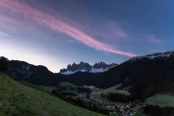Small Italian mountain town of St. Magdalena in Val di Funes at sunrise