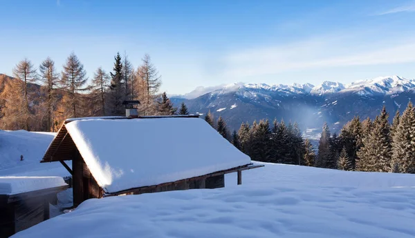 South tirol snow  mountains landscape and wood cabin winter trav